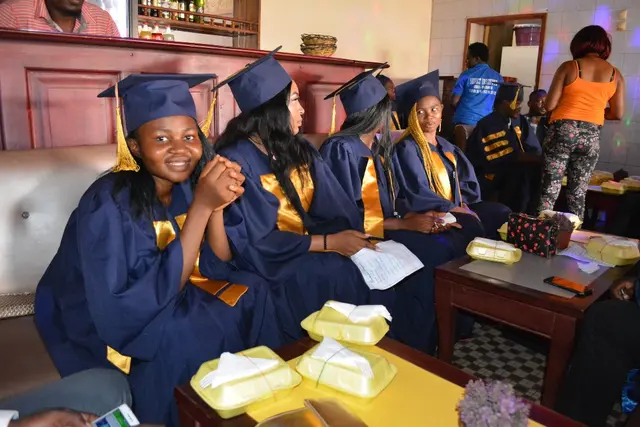 SEVIC-HITM graduating students in cap and gown